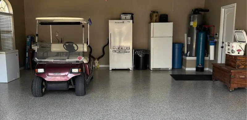 Finished flake epoxy garage floor with a golf cart in a Parker County home