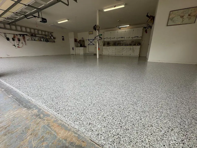 Bright garage with a light gray flake epoxy floor