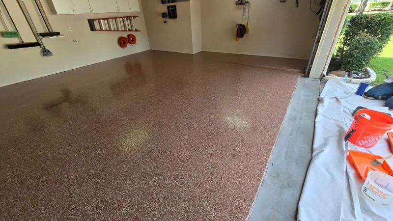 Garage with a custom red and tan flake epoxy floor